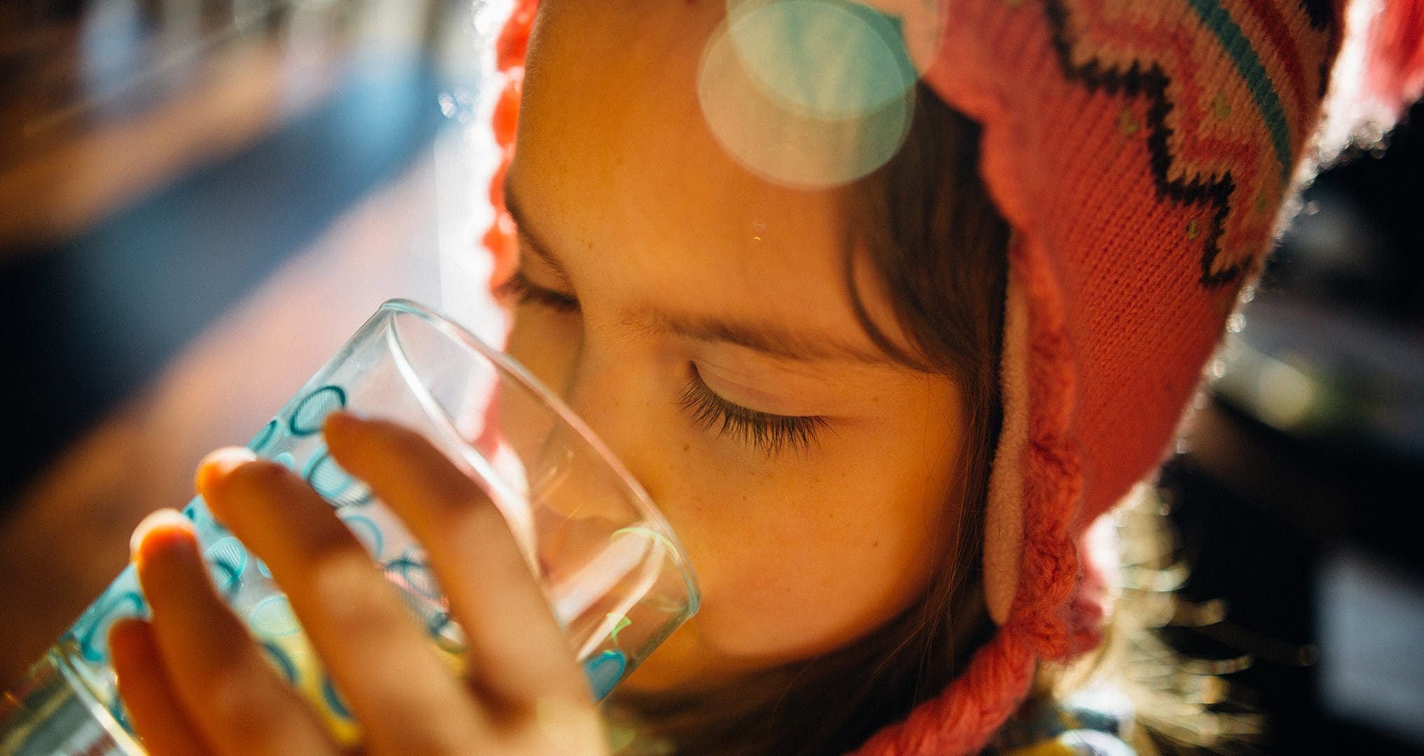 child drinking fresh water