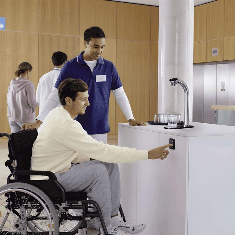 differently abled employee uses hydr8 ctap water dispenser